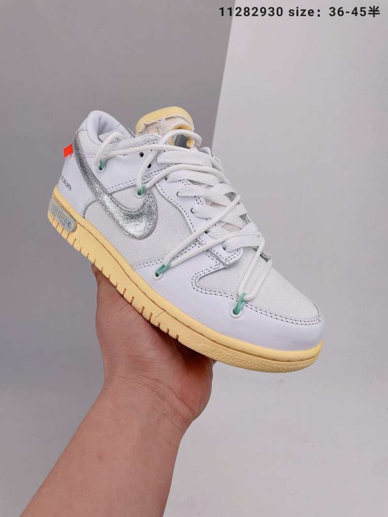white nike shoes with orange tag