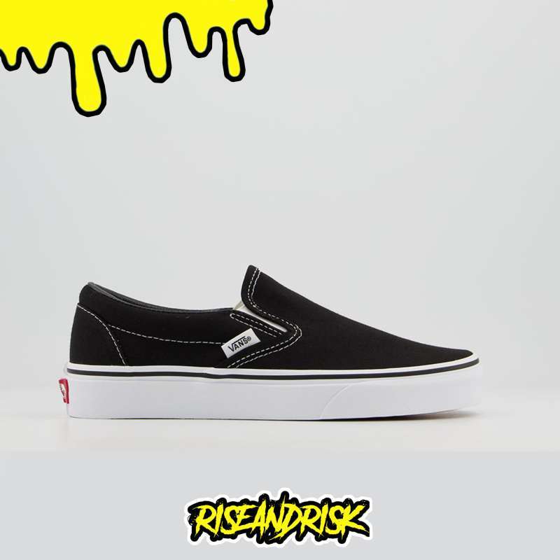 black canvas slip on vans