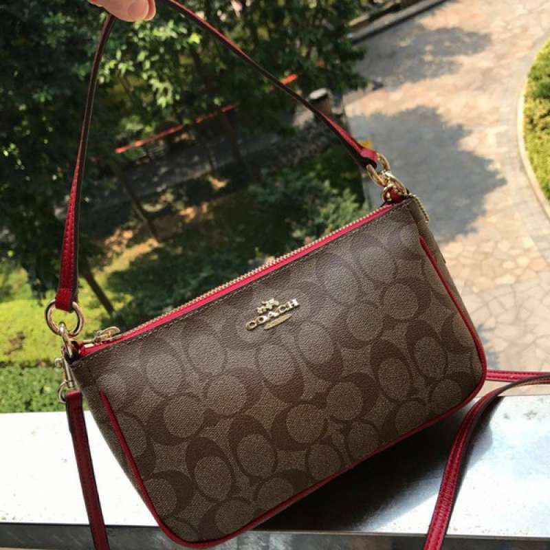 Coach top handle pouch in signature original best sale
