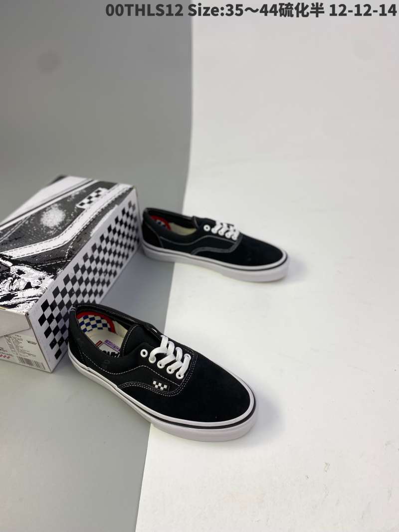 black canvas slip on vans
