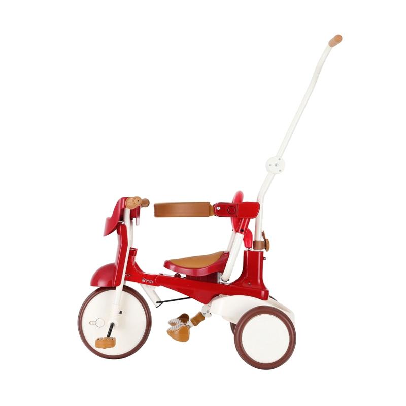 red metal tricycle