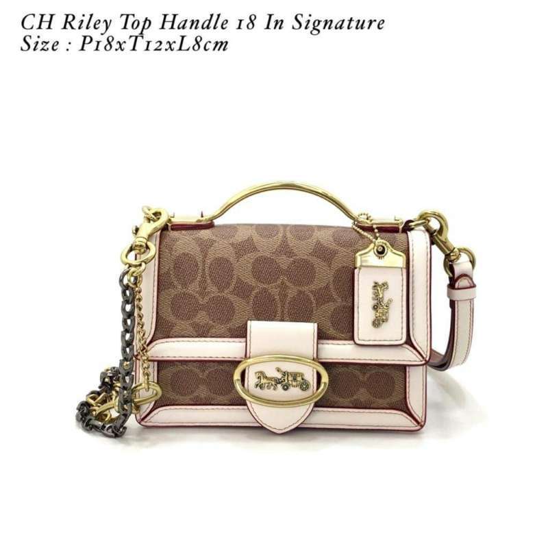 coach riley top handle 18 in signature canvas