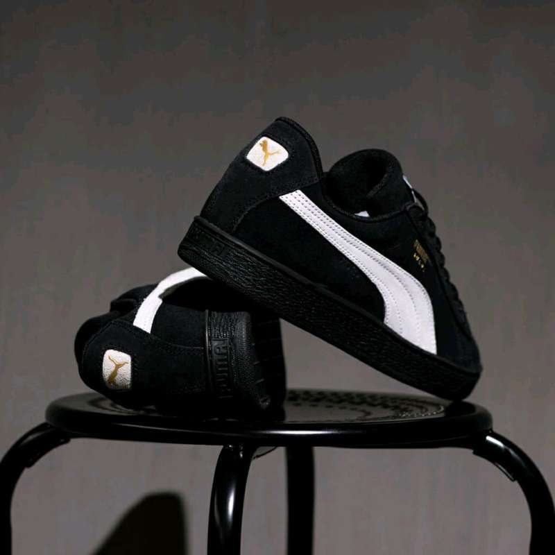 Puma suede black sole sales