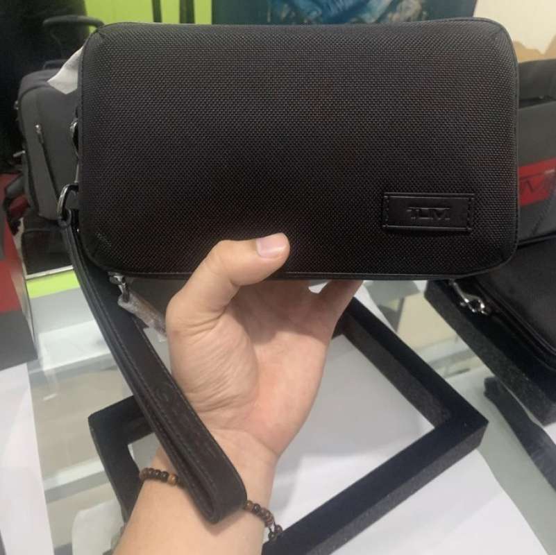 Tumi triple 2025 zip clutch