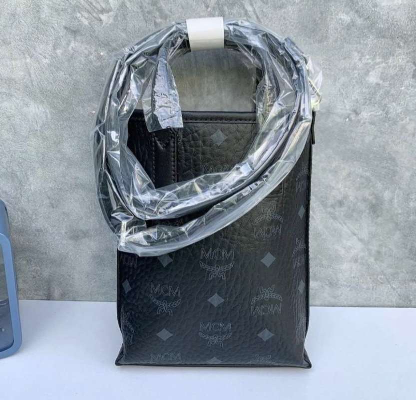 Jual MCM essential crossbody bag in visetos original black di Seller