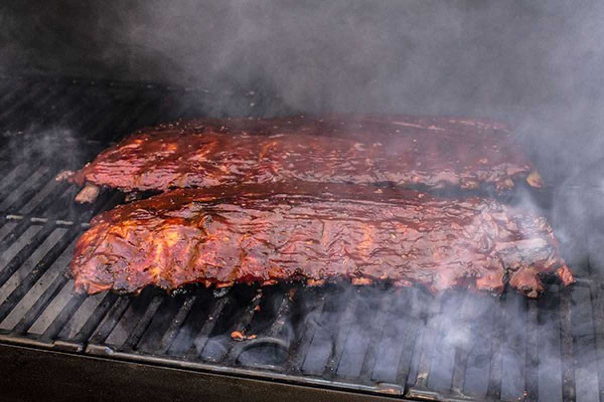 Pork Ribs Using Wood Chips On A Charcoal Grill Smoking Ribs With