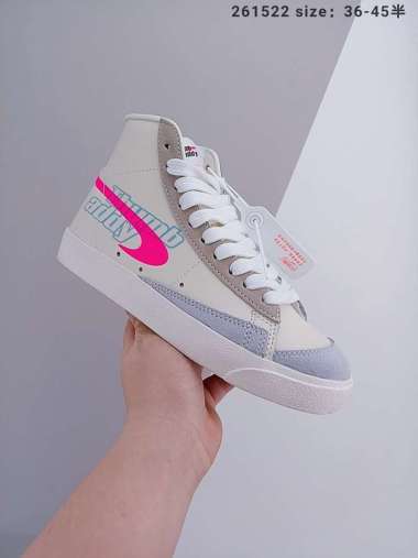 white and blue nike blazers