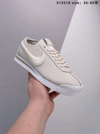 all white cortez womens