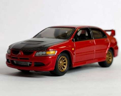 Johnny Lightning Diecast Mobil 2004 Mitsubishi Lancer Evolution Import Heat Skala 1:64